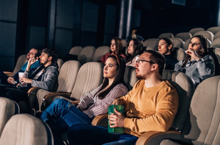 People watching a movie in a cinema.